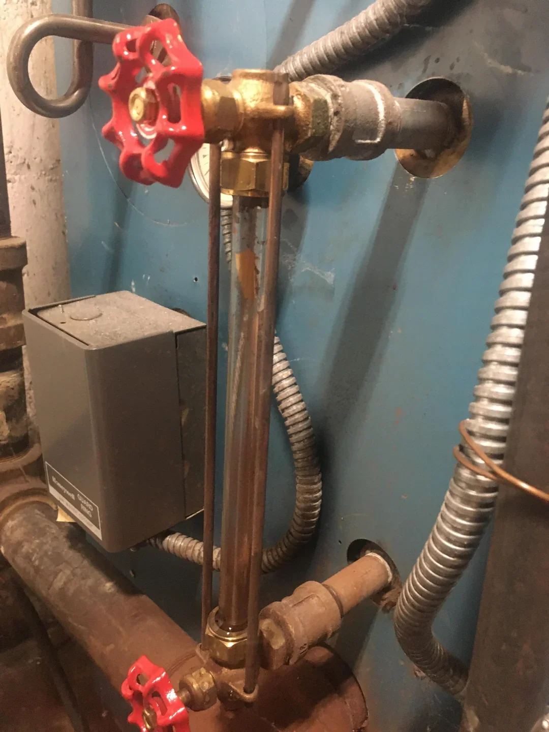 Burner flame inspection during monthly boiler maintenance
