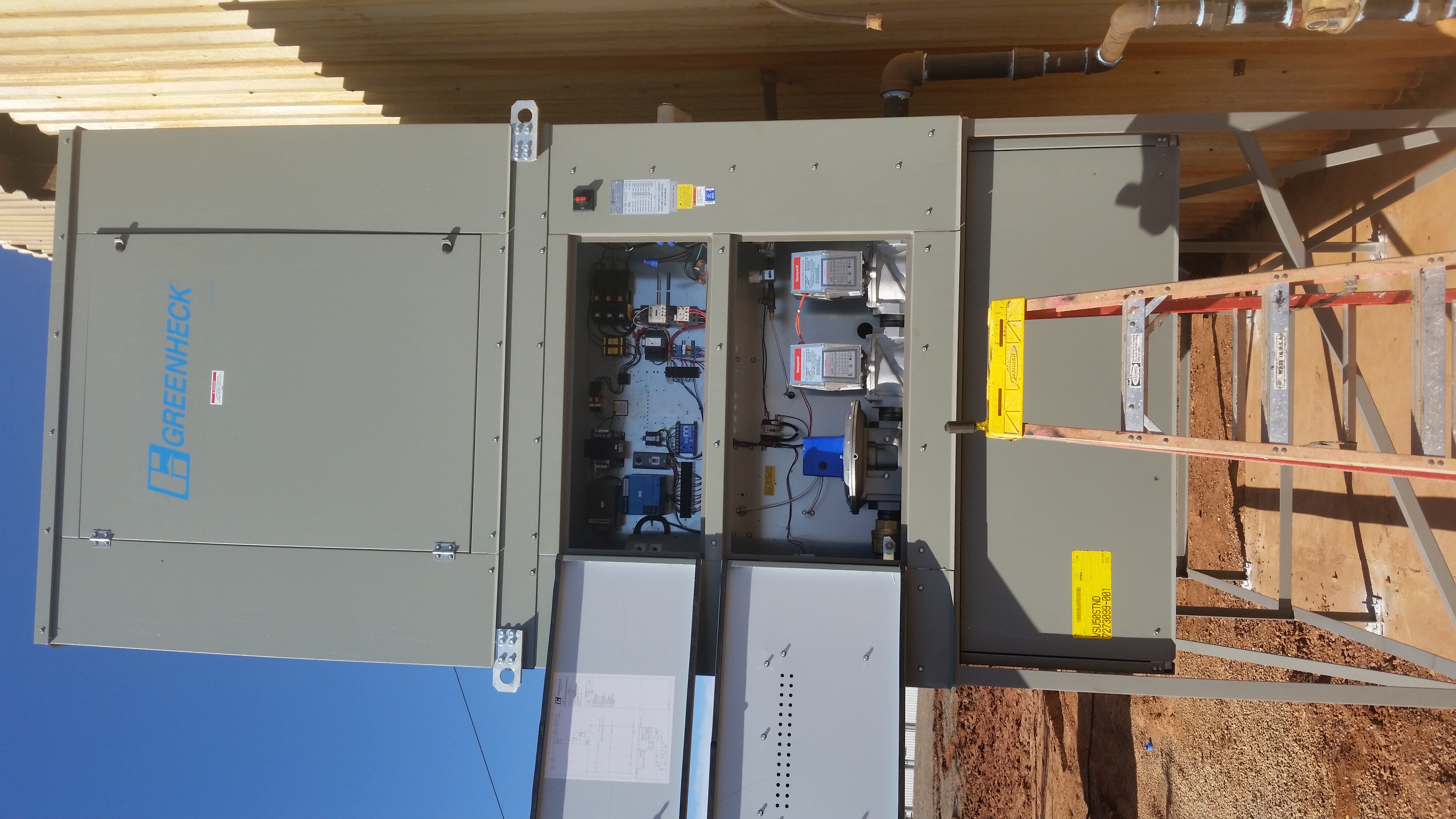 Interior view of the unit's control cabinet showing the gas train and flame safeguard controls