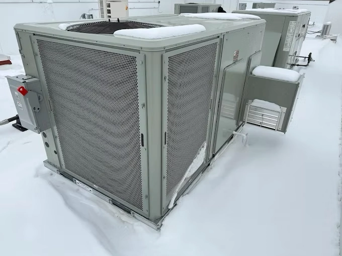 Rooftop HVAC unit covered in ice after Oklahoma ice storm